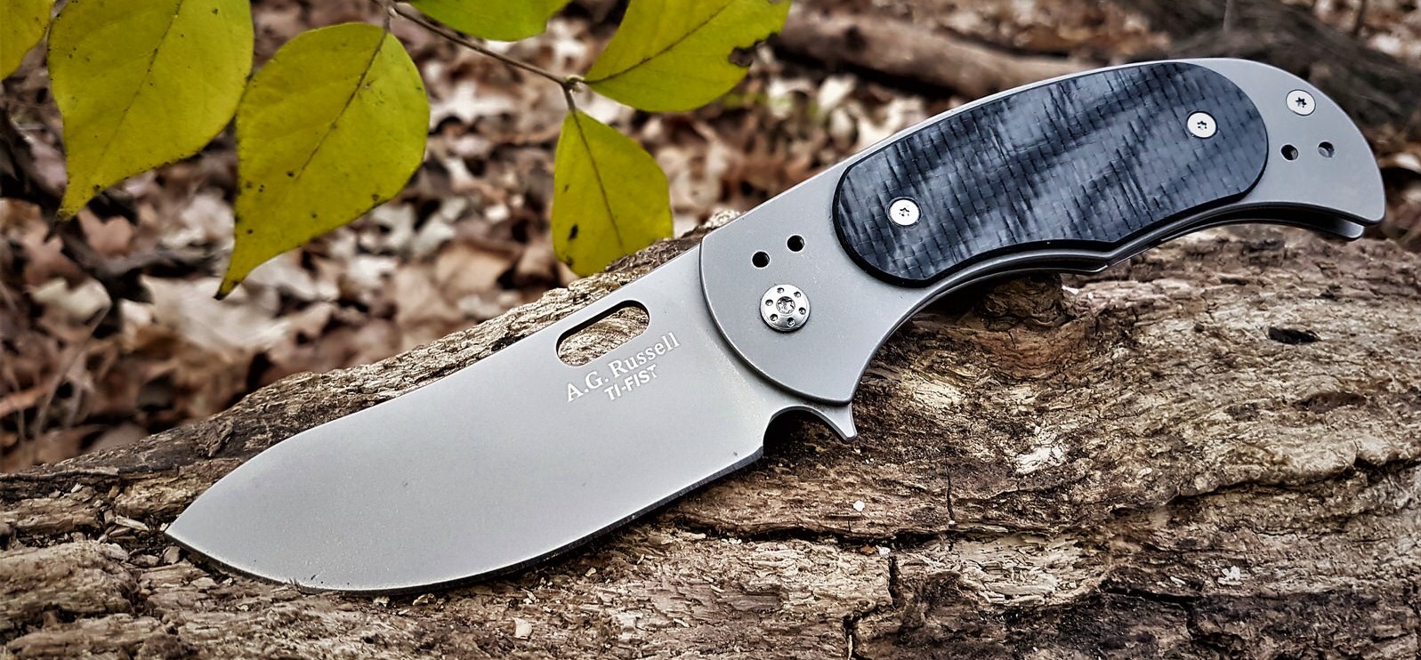 Ti-Fist with D2 steel in a big bellied blade with carbon fiber overlays and titanium handle